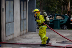 Someone-walking-in-with-a-hose